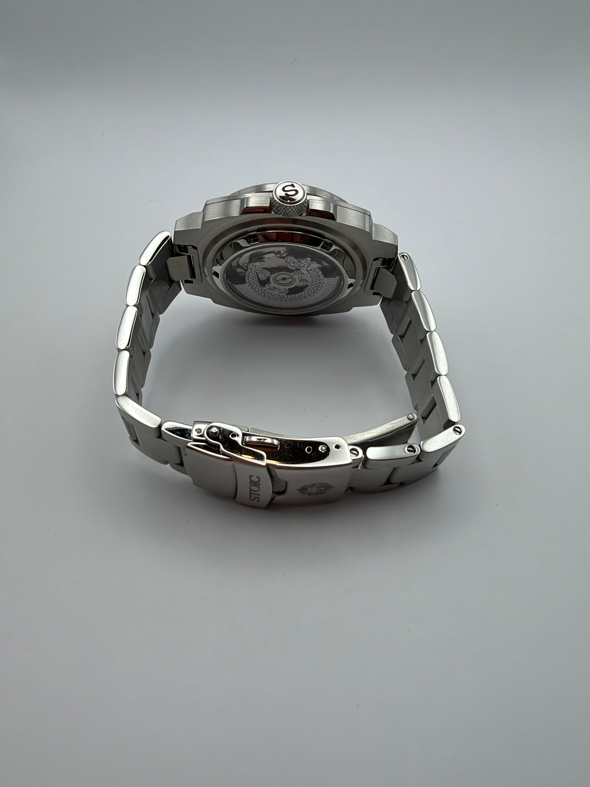 Vigor Dragonsteel Edition rear view showing a decorated display caseback and silver-tone bracelet clasp.