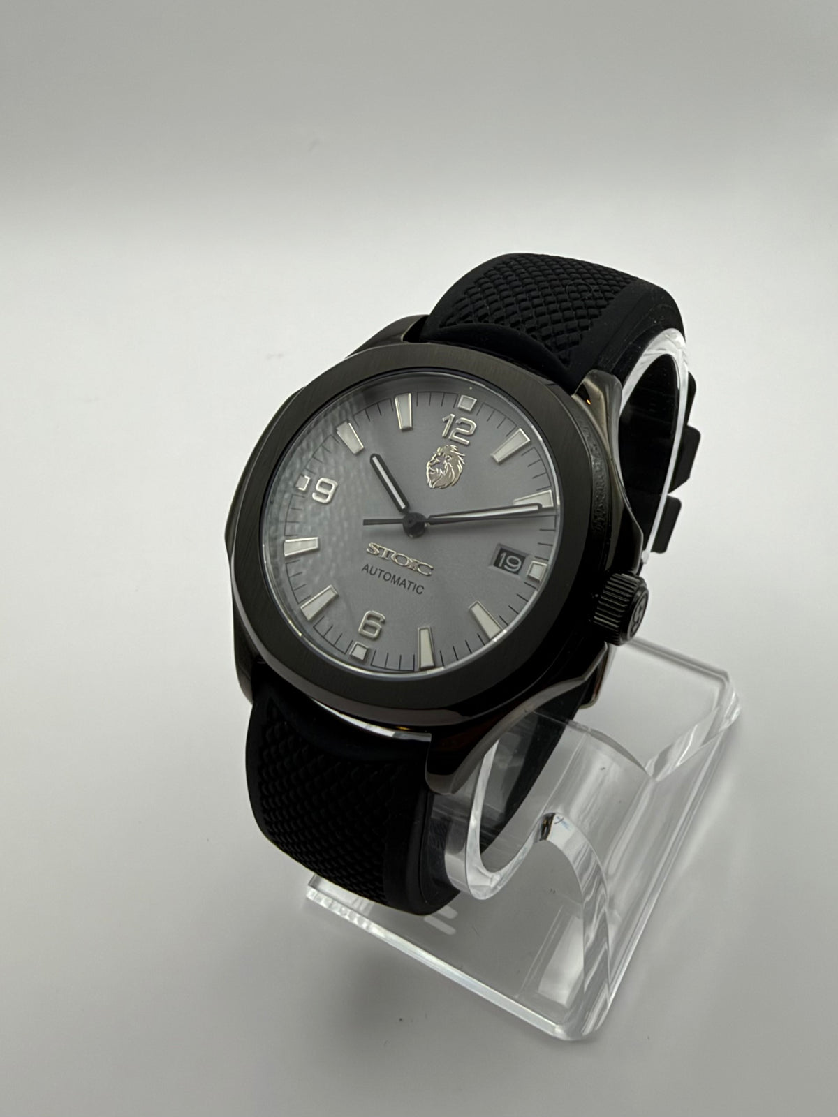 Sentinel at an angle, with a gray dial, black case and textured black strap.
