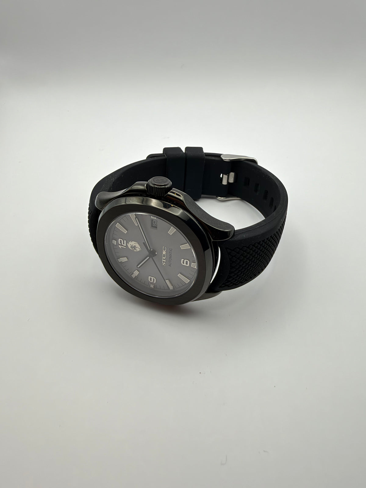 Sentinel resting at an angle, showing its black case and textured black strap.