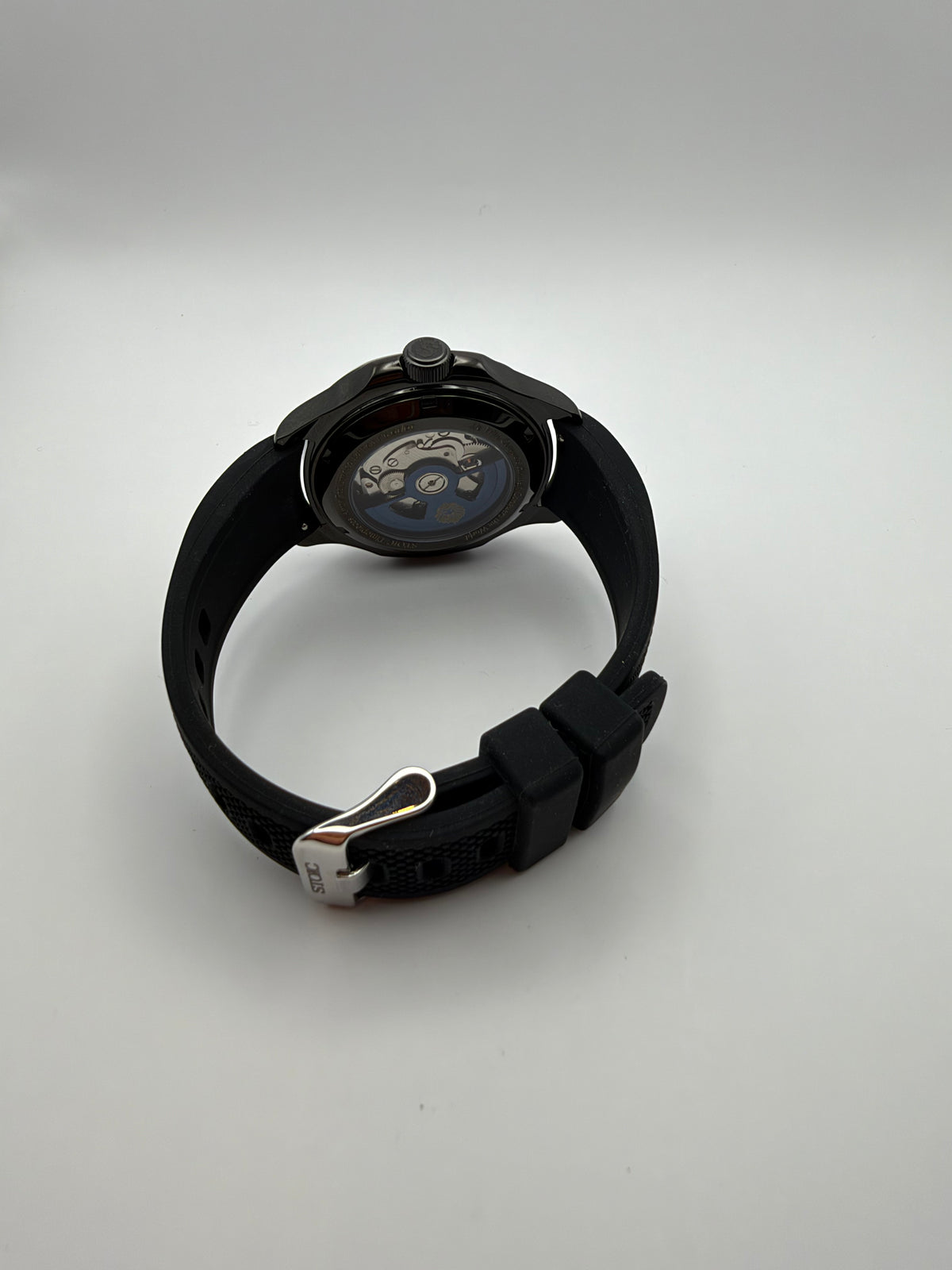 Sentinel rear view with a display caseback and black strap with a silver-tone buckle.