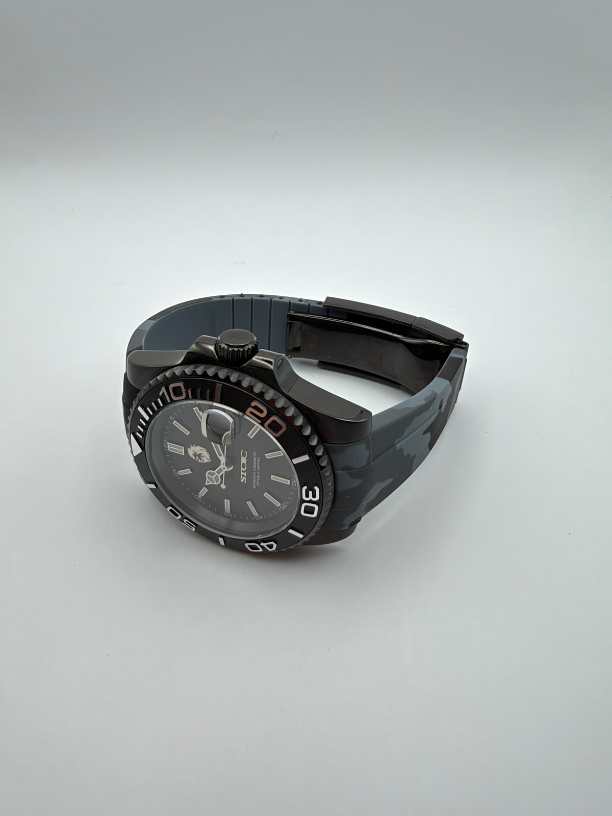 Blackout Diver resting at an angle, showing the camouflage strap and black case.