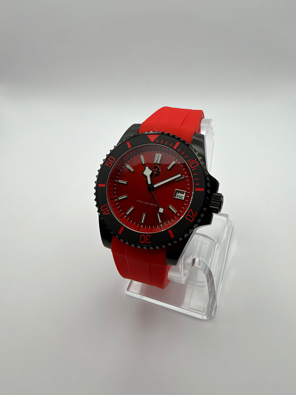 Pyra at an angle, with a red dial, black and red bezel, and red strap.