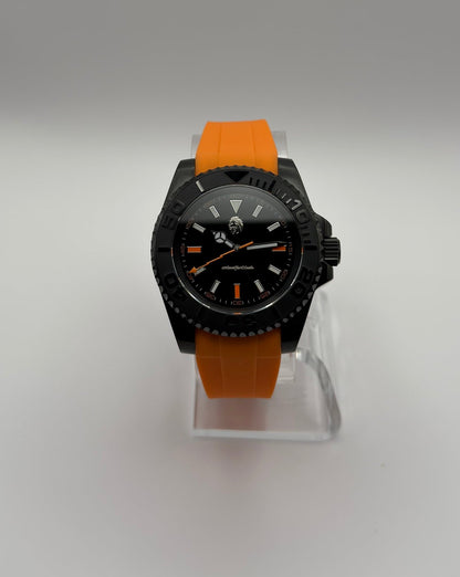 STOIC The Thalor: Front view of the black dial and orange strap