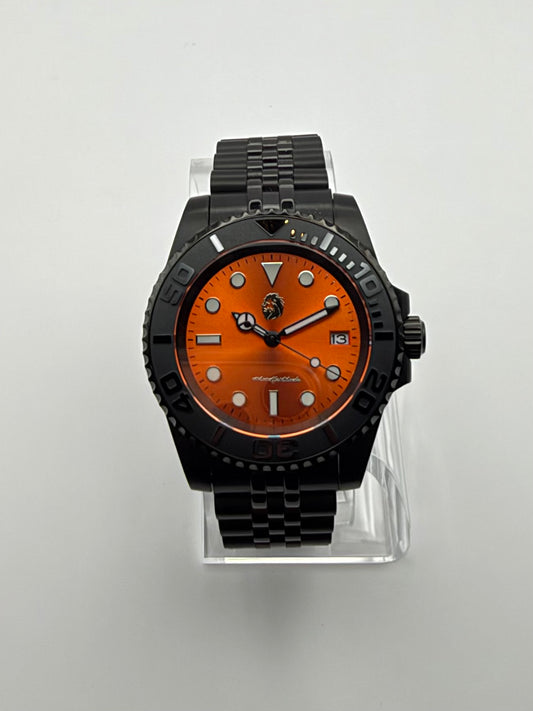 Ember Depth front view, with a bright orange dial, black bezel and black link bracelet.