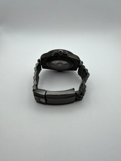 Ember Depth rear view showing a display caseback and black bracelet with a folding clasp.