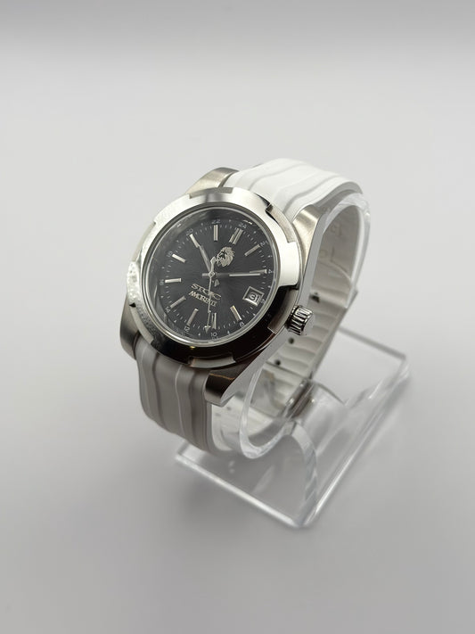 Noctis at an angle, with a dark dial, silver-tone case and white strap.