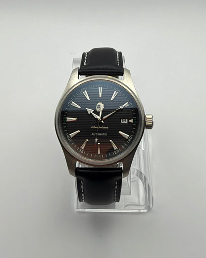 STOIC The Resolute: Front view of the black dial and dark strap.