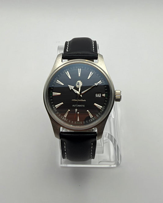 STOIC The Resolute: Front view of the black dial and dark strap.