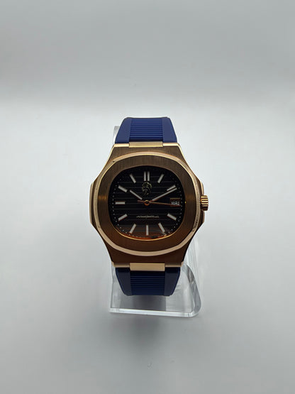Nocturne front view, with a black striped dial, gold-tone cushion case and blue strap.