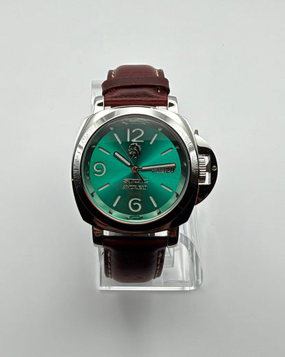STOIC The Arete Verde: Front view of the green dial and brown strap.