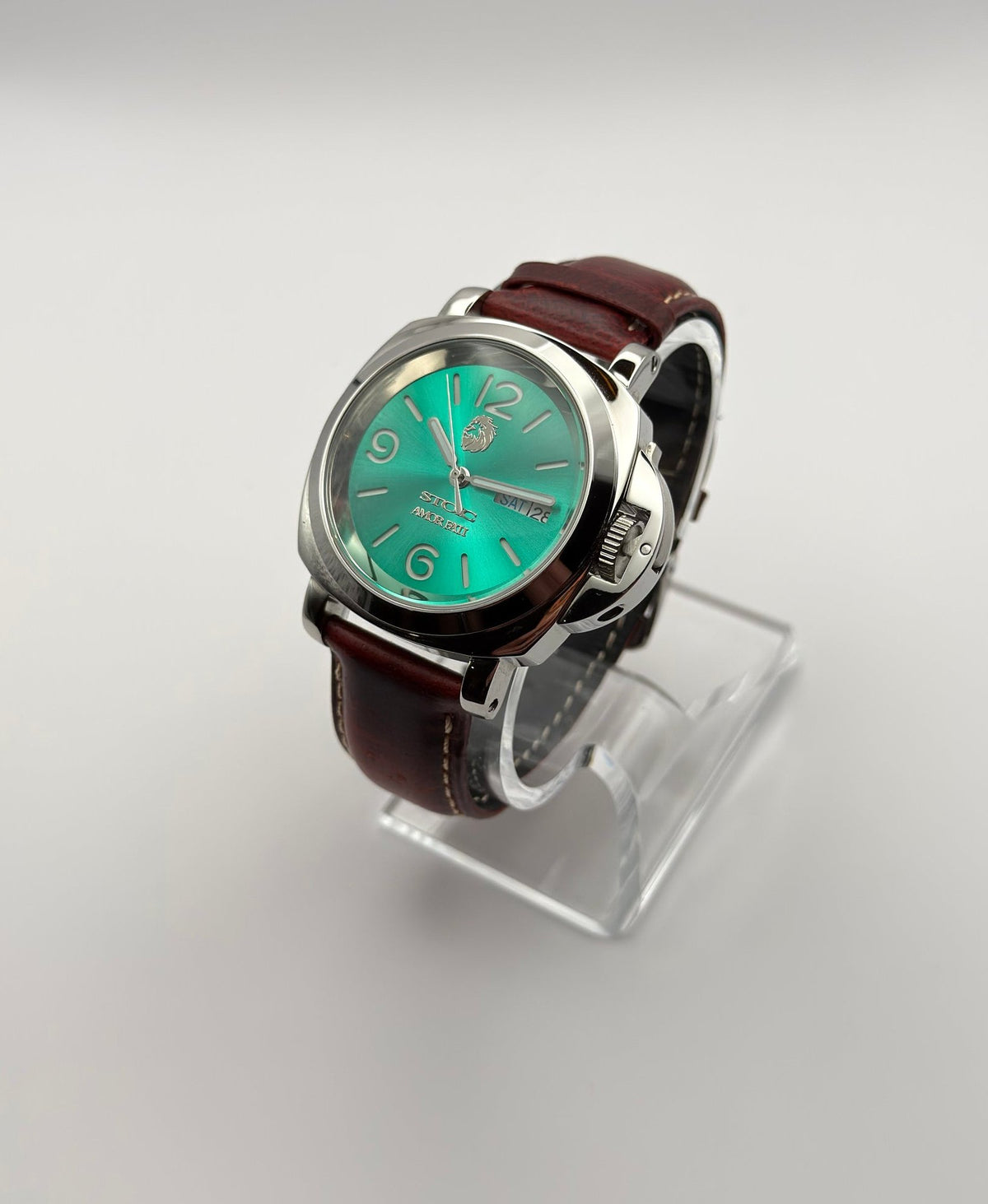 STOIC Arete Verde green dial watch with brown leather strap, angled front view