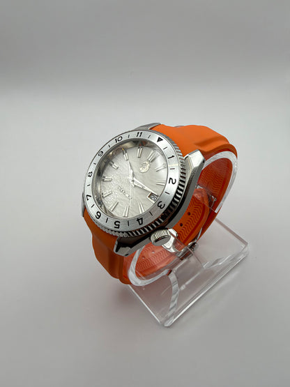 Equinox at an angle, showing its white dial, silver-tone case and orange strap.