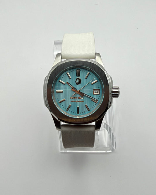 STOIC The Aether Aqua: Front view of the aqua dial and white strap.