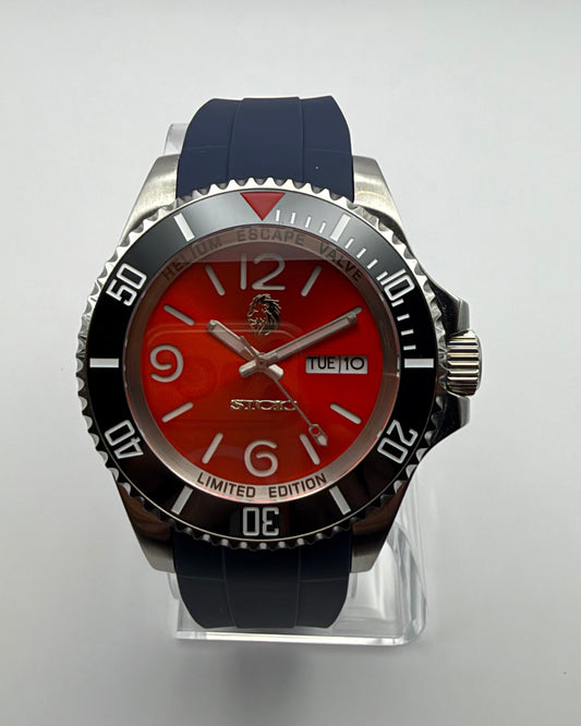 STOIC The Ignis: Front view of the red dial, black bezel and dark blue strap.