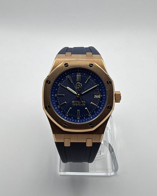 STOIC The Meridian: Front view of the blue dial, gold-tone case and blue strap.