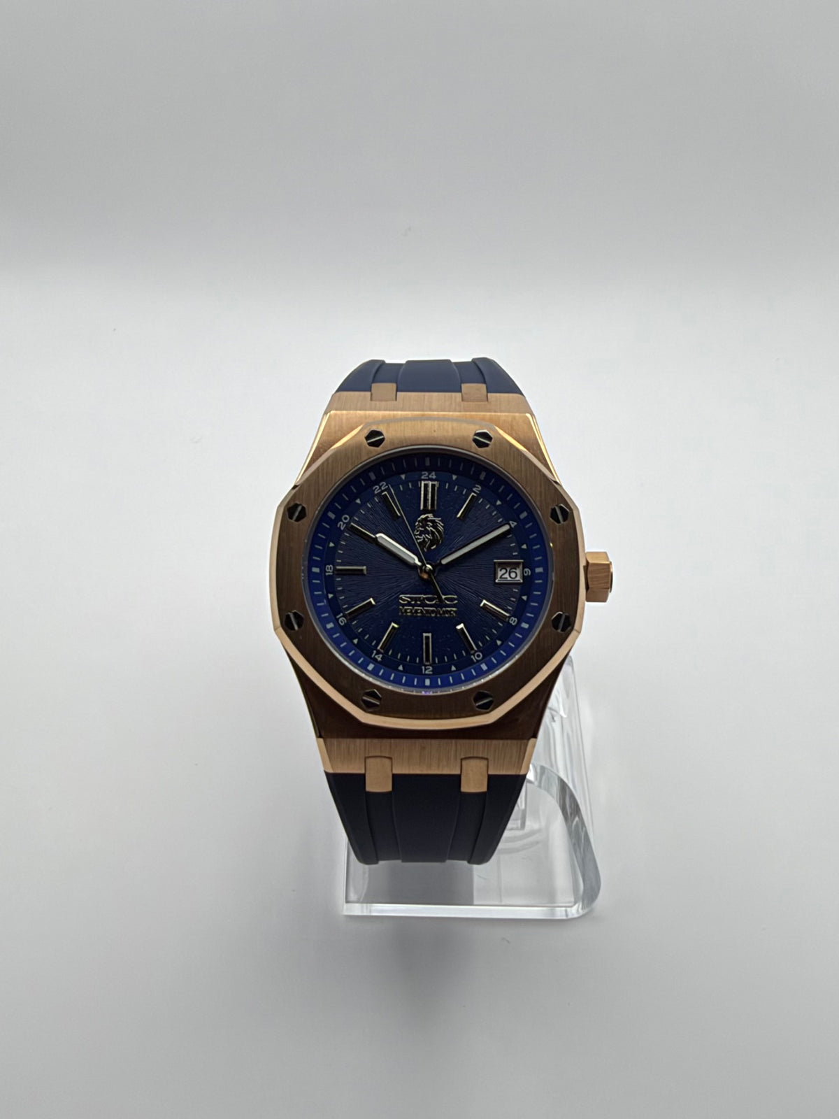 Meridian front view, with a blue dial, gold-tone octagonal case and dark blue strap.