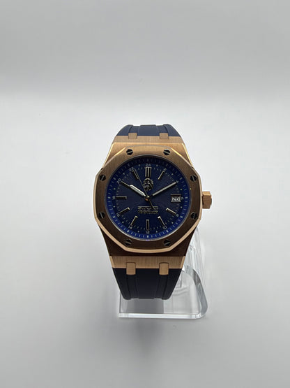 Meridian front view, with a blue dial, gold-tone octagonal case and dark blue strap.