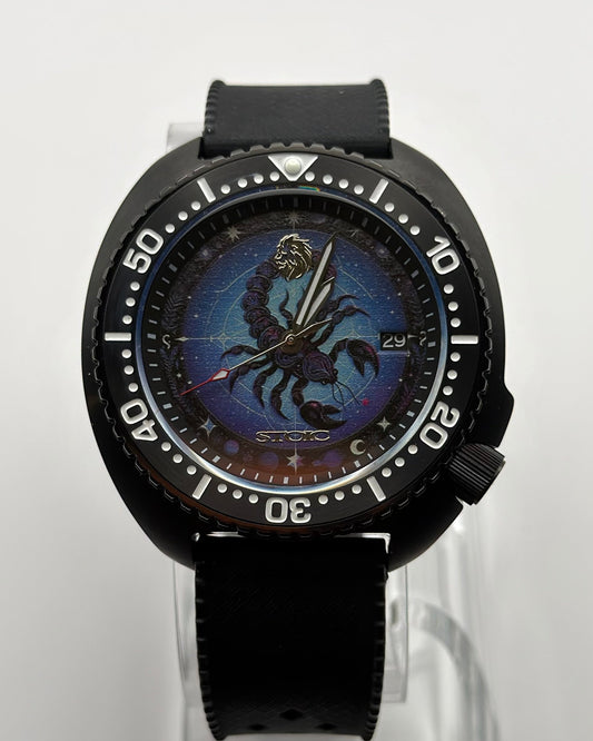 STOIC The Scorpius: Front view of the scorpion dial, black bezel and black strap.