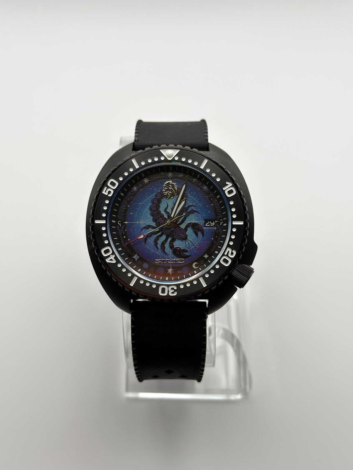 Scorpius front view showing the blue scorpion dial, date window and black bezel.