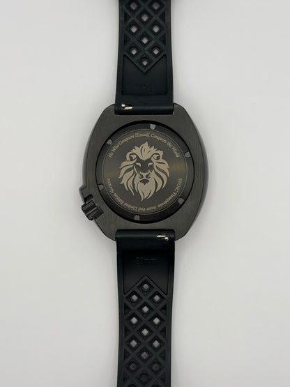 Scorpius back view with a lion engraving and the patterned underside of the black strap.