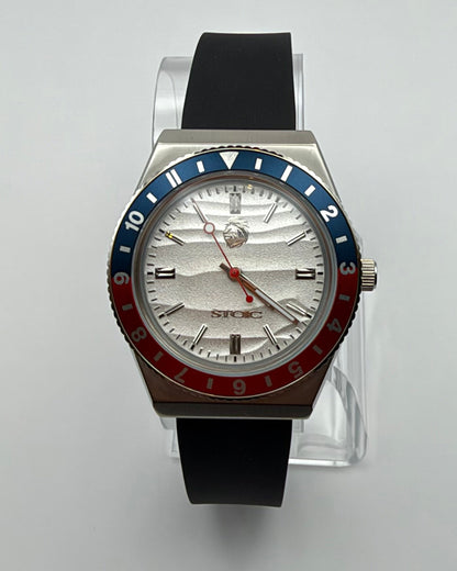 STOIC The Voyager: Front view of the light dial, red-and-blue bezel and black strap.