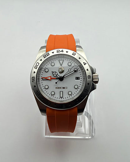 STOIC The Navigator: Front view of the light dial and orange strap.