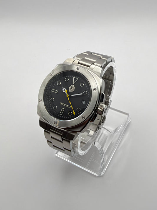 Vigor Dragonsteel Edition at an angle, with a black dial, yellow lightning-shaped hand and metal bracelet.