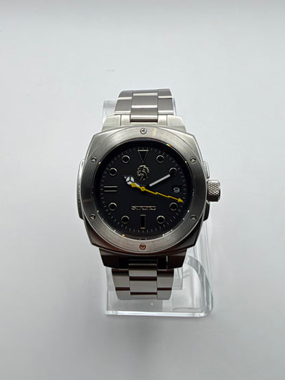 Vigor Dragonsteel Edition front view showing its black dial, yellow hand and silver-tone case.