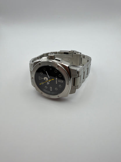 Vigor Dragonsteel Edition resting at an angle, showing the silver-tone case and link bracelet.