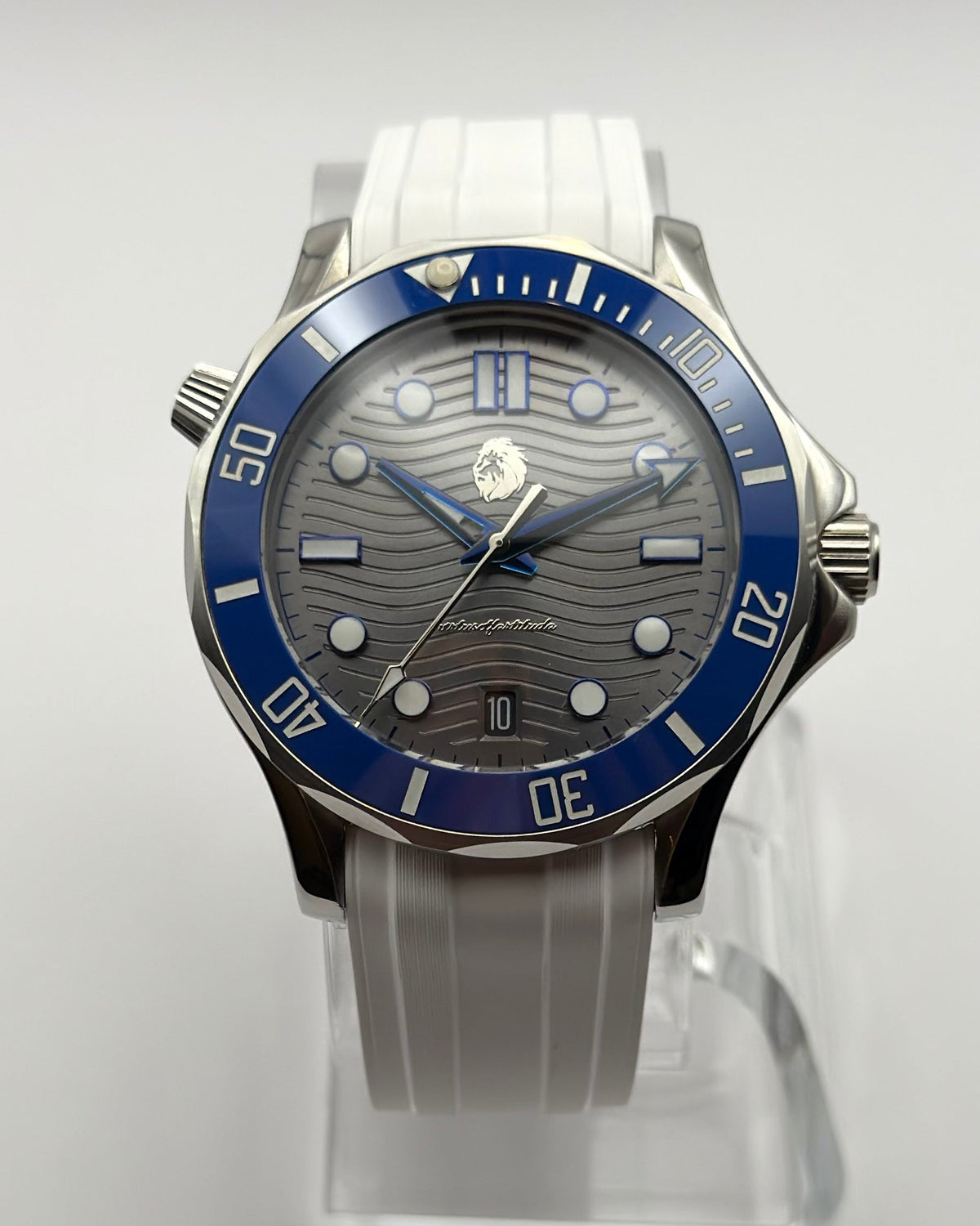 STOIC The Thalassa Blue: Front view of the gray wave-pattern dial, blue bezel and white strap.