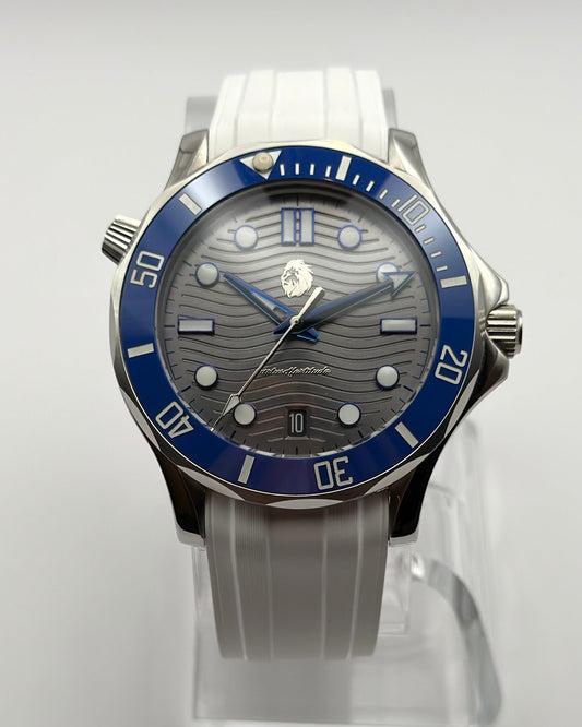 STOIC The Thalassa Blue: Front view of the gray wave-pattern dial, blue bezel and white strap.