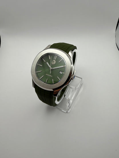 Viridian at an angle, with a green grid-pattern dial, silver-tone cushion case and green strap.
