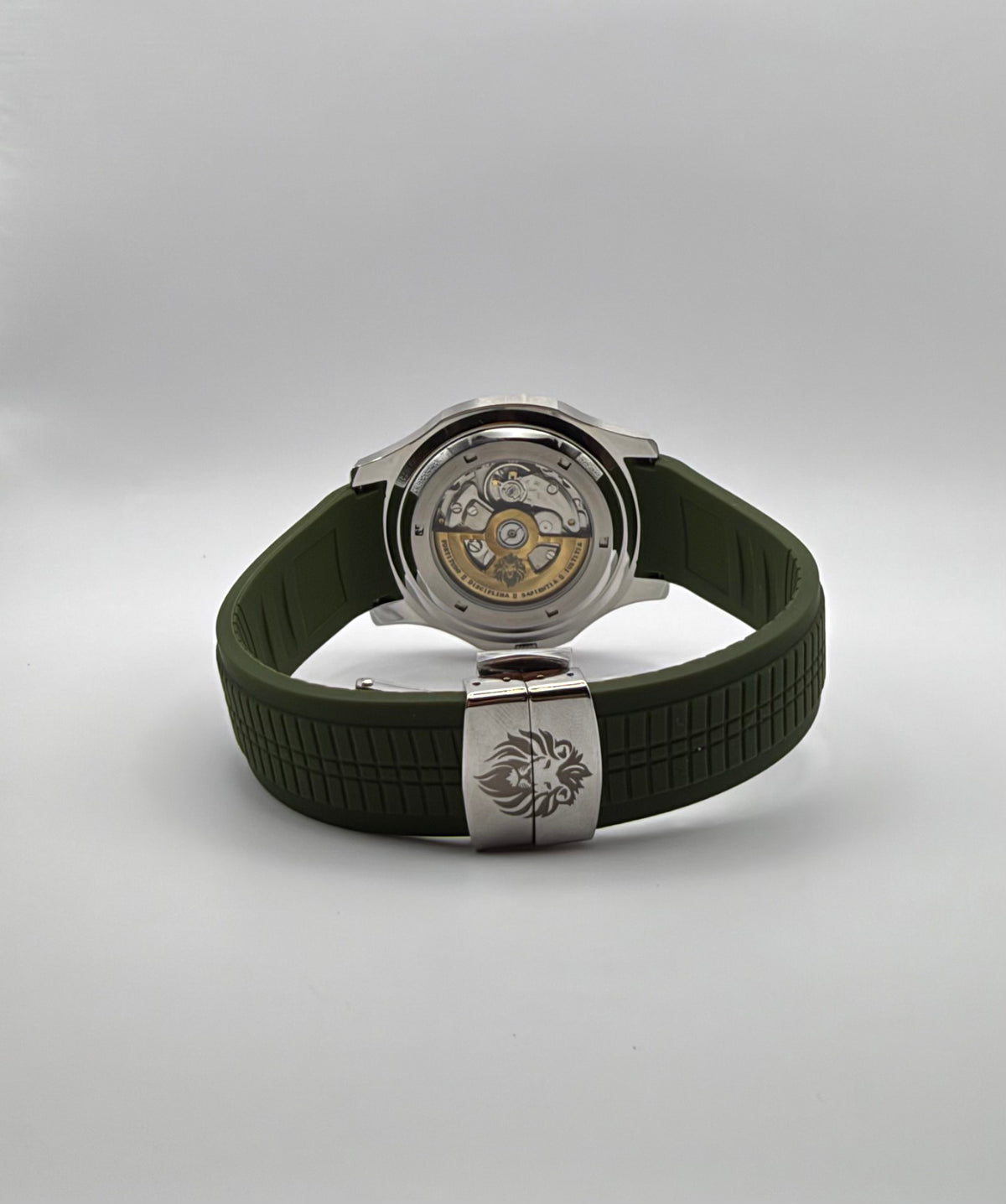 Viridian rear angle showing its display caseback and lion-marked folding clasp on the green strap.